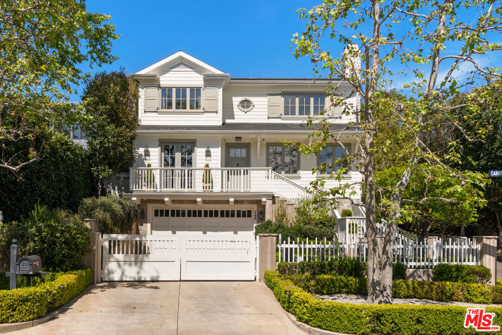 Set behind a gate on one of Brentwood's most coveted streets, this stunning 6-bedroom, 8-bathroom home blends timeless architecture with modern sophistication. Bathed in natural light, the interiors showcase exceptional craftsmanship, with custom millwork, wide-plank hardwood floors, and expansive windows framing views of the lush surroundings. The formal living room offers a serene gathering space with a stately marble fireplace, elegant coffered ceilings, and an adjacent office with a wet bar. The chef's kitchen is a true centerpiece, featuring dual islands, marble countertops, top-of-the-line appliances, and effortless flow into the open family room and out to the backyard. French doors throughout create seamless indoor-outdoor living, ideal for both relaxing and entertaining. Upstairs, you have four en-suite bedrooms, including the oversized primary with a balcony overlooking the yard. The primary bath features a separate shower and tub with two spacious walk-in closets. On the lower level, you'll find a private gym, home theater, temperature-controlled wine cellar, laundry, guest bedroom, and direct access from the garage into the house. The tranquil backyard is a private oasis with a sparkling pool, covered patio, and impeccably landscaped grounds framed by towering hedges. This extraordinary Brentwood residence offers refined living in a premier location where timeless design meets contemporary comfort. Just a short distance from the Brentwood Country Mart, the finest restaurants in Los Angeles, shopping, and much more!