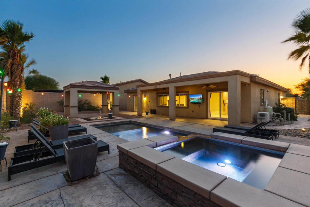 Take a look at the LOWEST PRICED home in The Gallery. This gated community is centrally located in the Coachella Valley with easy freeway access and low HOA dues that include your cable and internet! Situated at the end of a cul-de-sac with no neighbors behind or to the left of you, this home has an incredible outdoor living space that is perfect for year round entertaining. During the hot summer months you'll be able to enjoy the pebbletec saltwater pool or catch some shade under the large covered patio complete with ceiling fans. During the cooler months you can lounge in the spa or gather around the sunken firepit! A large detached gazebo is ready for you to design your outdoor kitchen with gas, electric, and plumbing already installed! You'll be just minutes from world class golf and The Living Desert, which is The Valley's only zoo. There is plenty of entertainment at the Acrisure Arena, including ice hockey! The fine dining and shopping of El Paseo and Rancho Mirage. Even downtown Palm Springs is only a 10 minute drive! The new Disney Cotino resort and community, and a surf park, DSRT SRF at the Desert Willow resort are both currently under construction just minutes away. Also conveniently located nearby is Home Depot, Lowes, Costco, Sam's Club, Walmart and so much more! Schedule your showing today!