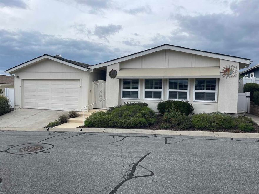 Beautifully remodeled 2 bed/2 bath home with open floor plan in the active 55+ community of Vista Del Mar! Living room with plantation shutters, large dining area with built-in buffet, and updated kitchen featuring granite counters, white cabinetry, and newer appliances. Spacious laundry area includes washer/dryer (refrigerator also included!). Luxurious primary suite offers oversized bedroom, spa-like bath with granite dual-sink vanity, walk-in tub, separate walk-in shower, and three closets (including a big walk-in). Guest bath is accessibility-ready with walk-in shower! Enjoy low-maintenance landscaping with a dedicated vegetable garden area and a lovely covered patio. Attached 2-car garage. Move-in ready and loaded with upgrades—perfect for easy 55+ living!