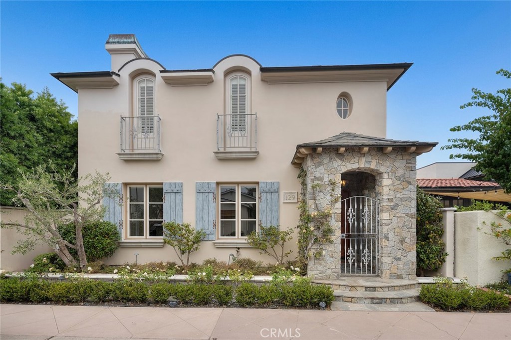 Charming and timeless, this 3-bedroom, 3.5-bathroom residence is ideally located on coveted Lido Island in Newport Beach. With its European-inspired architecture, stone-clad entry, and custom details throughout, the home blends coastal elegance with everyday comfort. Inside, you'll find wide-plank hardwood floors, a cozy fireplace, built-ins, and French doors that open to private patios perfect for entertaining. The gourmet kitchen features granite counters, high-end appliances, and seamless flow into the main living spaces. All bedrooms are en-suite, including a serene primary suite retreat. Just moments from the bay, Lido Marina Village, and community amenities, this home offers the best of island living.