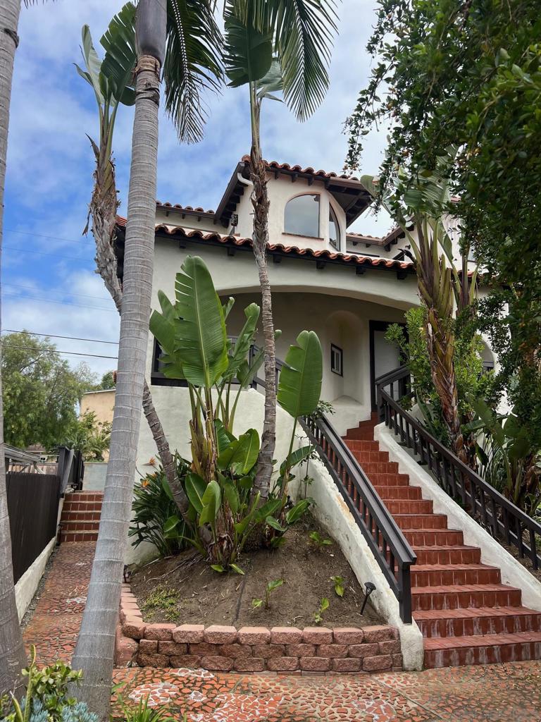 Incredible North PB rental opportunity - just in time for summer! West facing 3 bed, 2.5 bath townhouse in a charming Spanish-style complex, with tropical landscaping. Enjoy ocean views from almost every room, especially on the middle floor patio and the rooftop deck. Bright and airy living space with high ceilings and a beehive fireplace. Tandem two car garage is accessible from the alley behind the unit. Short walk to the grocery store, local shopping, and the beautiful beaches. Don't miss your chance to call the beach home this summer!