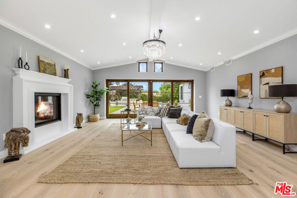One of the lowest prices per square foot homes in Palos Verdes. A coastal sanctuary for a luxurious lifestyle brings you this stunning, newly constructed, ground-up build in 2025. This Mediterranean estate is located in the prestigious Alta Vista Community of Rancho Palos Verdes' Country Club area. Remarkably spacious single-story residence set on nearly half an acre of beautifully landscaped grounds. Boasting over 7,000 square feet of living space, this home provides a lavish living experience, with exceptional amenities at your disposal. A harmonious blend of architectural beauty and natural surroundings defines this home's exterior. Featuring stylized balustrades on the front balcony and European stone accents that enhance its classic architectural charm. Upon entering through the ornate wrought iron and glass double doors, you're greeted by a grand, elegant foyer featuring a striking fireplace, soaring ceilings, rich wide-planked engineered hardwood flooring, and recessed lighting, to create an inviting atmosphere. Inside, the home continues to impress with custom, solid hardwood interior windows, sills and jambs, adding warmth and sophistication to every window. ADT home security system with outdoor video system. Designed with convenience in mind, this home offers intuitive access to all key areas. Whether moving between the East and West bedroom wings, transitioning from the media room to secondary living spaces, or heading to the three-car garage, the layout ensures smooth transitions throughout. Included in the footprint is a media/yoga room with a large front facing office, adjacent to a large secondary front den. Every space is thoughtfully positioned to enhance daily living and accommodate various lifestyles. This exquisite residence offers versatility for hosting gatherings, accommodating multi-generational living, or making it your own pied-a-terre. Gourmet Kitchen with Premium Appliances: This expansive chef's kitchen is equipped with top-tier KitchenAid appliances, including a 48" commercial-style gas range featuring six burners, dual ovens, and a griddle. The range offers precise control with two dual-flame burners, ideal for searing, simmering, and sauteing. Smart connectivity allowing you control the oven remotely via the KitchenAid app or voice assistants like Google Assistant and Alexa. A Zephyr wine refrigerator with a 53-bottle capacity and dual-zone temperature control, perfect for wine enthusiasts. The kitchen also features a farmhouse-style sink and a massive quartz-top waterfall island, providing ample space for meal preparation and entertaining. An open-concept layout ensures effortless flow from the kitchen to the massive dining space, ideal for both intimate meals and larger gatherings. Offering eight generously sized bedrooms, thoughtfully divided into two wings for optimal privacy and convenience. Six of these bedrooms feature their own en-suite bathrooms with modern finishes such as elegantly appointed pristine quartz countertops, complemented by exquisite marble and stone tiles, creating a sophisticated and timeless aesthetic. The primary suite stands out with its own fireplace, providing a cozy retreat. At the heart of the home lies a grand living room, serving as a place for all to come together and enjoy a nightcap or tea. This room is anchored by a magnificent fireplace, creating an inviting ambiance for both entertaining guests and enjoying serene moments. Large windows frame views of the meticulously landscaped outdoor pool area, blending indoor and outdoor living. Why venture to the Cameo Resort & Spa in Beverly Hills when you have your own luxurious sanctuary right at home? Step into your private oasis featuring a heated lap pool and spa, adorned with laurel hedges and vibrant California succulents. The outdoor kitchen and barbecue station, complete with a pergola and stone fireplace, offer the perfect setting for alfresco dining and evening gatherings. Schedule an appointment today