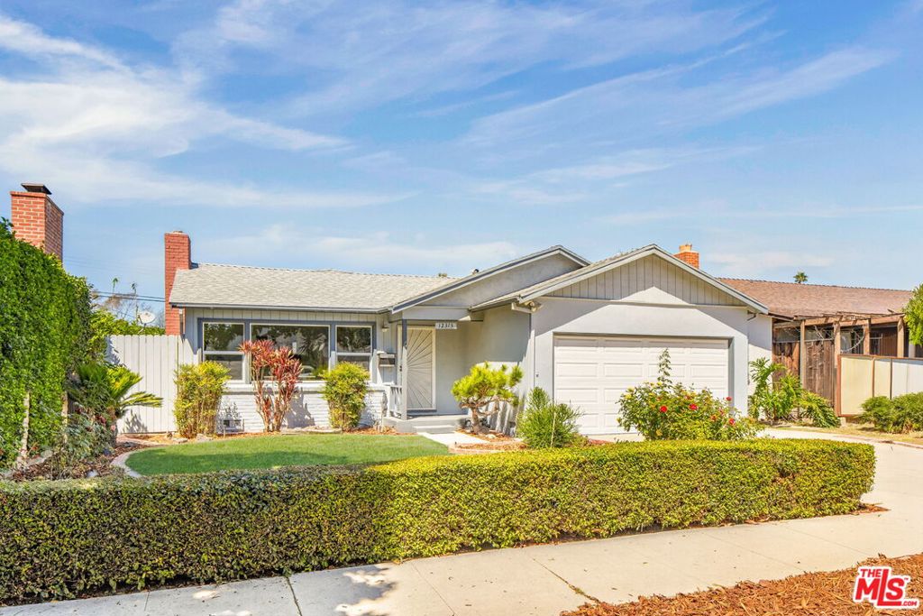 In the heart of Playa Vista, this single-level Mid Century home blends timeless character with modern comfort across 1,709 square-feet of living space. Enter to an expansive living and dining room centered on a classic brick fireplace, creating a warm and inviting atmosphere. Here, large windows line the space, inviting in radiant natural light throughout the interiors. The kitchen charms with period tile countertops, abundant storage, stainless steel appliances--including a gas cooktop and double ovens--and a cheerful breakfast nook. Flow seamlessly through glass sliders that open to a generous covered patio and private backyard with a grassy lawn and lush landscaping, ideal for relaxing and entertaining. Four spacious bedrooms with ample closet space provide comfort, including one with direct access to the backyard--making it versatile for a home office, den, or media room. Thoughtful amenities include new flooring throughout, central AC/heat, a storage shed, a laundry area, and an attached two-car garage. Supremely located near neighborhood favorites, including Westfield Culver City, the Ballona Creek Bike Path, Whole Foods, and just minutes to the beach, this home delivers convenience and charm in a prime Westside setting.