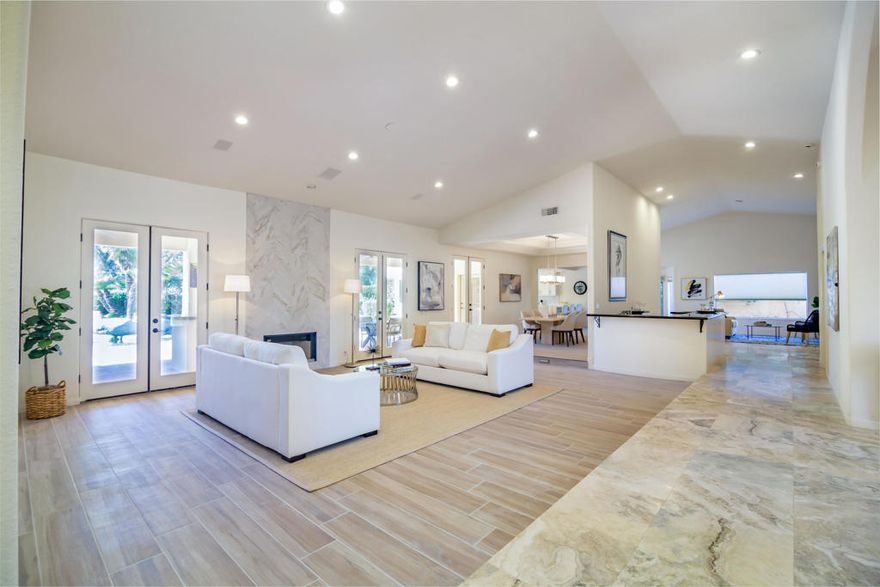 Experience unparalleled luxury in this exquisite estate offering 4 spacious bedrooms each with its en-suite bathroom; encompassing over 3,900 square feet of refined living space. Nestled within the prestigious Avondale Country Club in Palm Desert, this residence boasts prime 5th fairway views and a truly spectacular setting. Step into your private desert paradise featuring a stunning pool with shimmering waterfalls, a rejuvenating jacuzzi, opulent lounge areas, a covered wet bar, outside pool bathroom and lush, meticulously landscaped gardens--perfect for embracing breathtaking desert sunsets. The interior has been tastefully renovated, featuring sophisticated flooring, waterfall style islands in the kitchen along with brand new stainless steel appliances and cabinets. In addition, all interior bathrooms have been remodeled and beautifully updated exuding luxury at every turn. Included HOA amenities encompass 24-hour gated security, a prestigious social membership to the championship golf course, a state-of-the-art fitness center, tennis courts, and pickleball. Just 15 minutes from the world-renowned shopping on El Paseo, this luxurious estate offers an exceptional blend of prestige, comfort, and leisure.