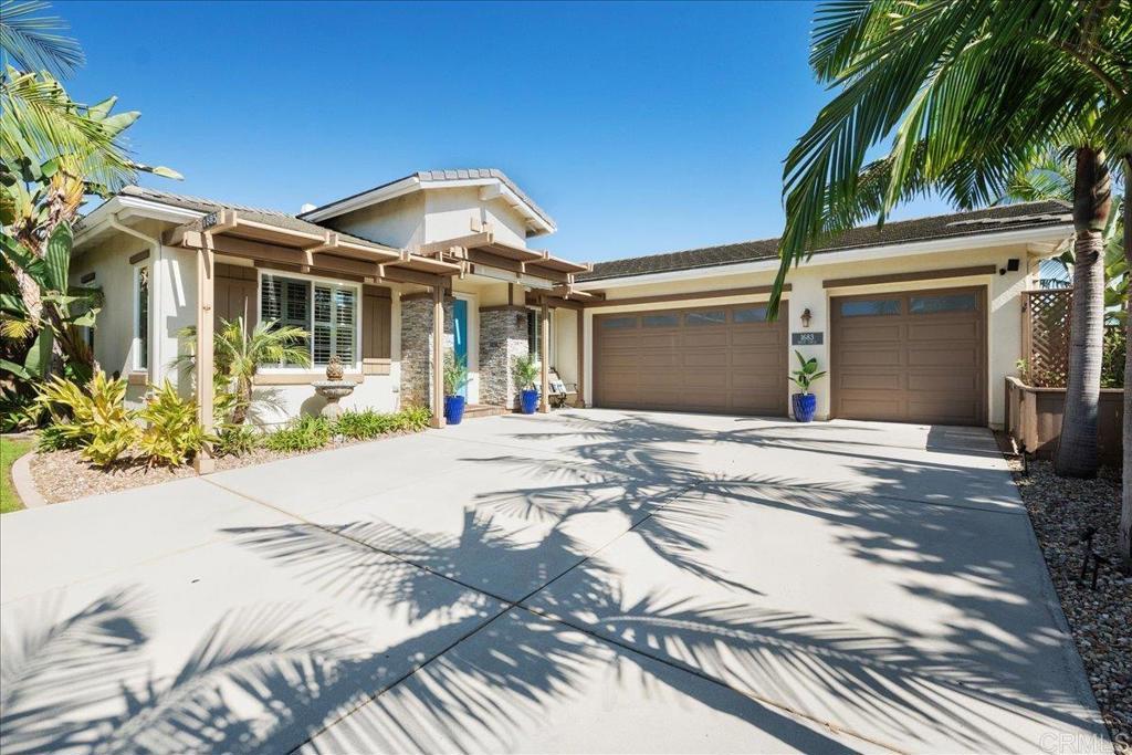 Located in the heart of Olde Carlsbad, this stunning single-level home blends modern convenience with effortless coastal charm. Built in 2002, the 4BR/3.5BA residence features soaring 10-ft ceilings, a spacious great room and a separate dining area. The chef’s kitchen includes a large island, custom hood, built-in griddle, stainless steel appliances, sliding-drawer cabinetry, double ovens and an Everpure water filtration system supplying both the sink and fridge. The luxurious primary suite boasts a walk-in closet and spa-like bath, while engineered wood flooring runs throughout the home. The three additional bedrooms offer flexibility for guests, home offices, or hobby spaces. Upgrades include owner solar, central A/C, whole-house fan, tankless water heater, regenerative charcoal filter, and dual washers and dryers in the garage laundry area. Set on a large, private lot, with only one direct neighbor sharing a backyard boundary, the property offers both space and tranquility. Outdoor living is exceptional with a 37k-gallon saltwater pool and spa with solar heater, professionally landscaped yard, gazebo, fire pit, outdoor shed with power for beach gear, and an exterior pool bathroom and shower added in 2018. The sideyard is equipped with gas, electrical, water and drainage for an outdoor kitchen. The 3 car garage features epoxy garage flooring, 220V plug for EV and an additional fridge and freezer. No HOA, no Mello-Roos. Just minutes from the beaches, Carlsbad Village, shopping, dining, and top-rated schools, this property offers the perfect coastal lifestyle.