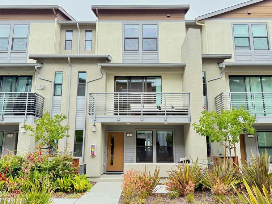Experience modern living in the heart of Santa Claras renowned Naya community. Built in 2021, this bright and versatile 4-bedroom, 3.5-bath townhome lives like a single-family home with sleek finishes, flexible space, and designer upgrades throughout. The entry level offers a private junior suiteperfect for guests, multigenerational living, or a dedicated home office. Upstairs, the open-concept main level is filled with natural light, wide-plank floors, and airy ceilings. At the center: a modern kitchen with quartz counters, stainless steel appliances, dual-sided island, and an impressive walk-in pantry. Oversized sliding glass doors open to a sunny balcony, while the full-size front porch overlooks the landscaped courtyard. Smart upgrades include a tankless water heater, whole-house water softener, custom closets, and a pre-installed EV charger in the attached 2-car garage. HOA covers water for added ease. Conveniently located near Central Park, Santa Clara Library, Kaiser, major employers, shopping, dining, and San Jose Airportthis is move-in ready living designed for today.
