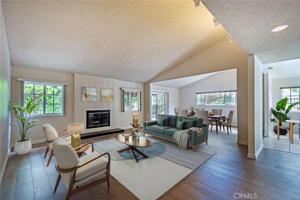 Welcome to this 3-bed, 2-bath single-story home located in the peaceful hills of Valley Circle Estates in West Hills. Offering over 1,750 square feet of living space, this home features high vaulted ceilings in the living room and bedrooms, wood-laminate flooring throughout, and a functional layout that offers flexibility for everyday living. The kitchen offers plenty of cabinet space and a comfortable eat-in breakfast area, along with a separate formal dining room and a large great room with a fireplace—perfect for relaxing or entertaining. Enjoy the private backyard with a covered patio and elevated observation deck, ideal for soaking in quiet hillside views and evening sunsets. The home also includes a private 2-car garage with laundry hookups. Conveniently located near top-rated schools, including Pomelo Community Charter, Hale Charter Academy, and El Camino Real Charter High School (tenant to verify enrollment requirements). Just minutes from Warner Center, The Village, and shopping and dining in Woodland Hills, Porter Ranch, and more. No pets preferred, but may be considered depending on breed and size. This is a great opportunity to lease in a desirable neighborhood at a competitive price. Reach out today to schedule a tour! *Two photos have been digitally staged.