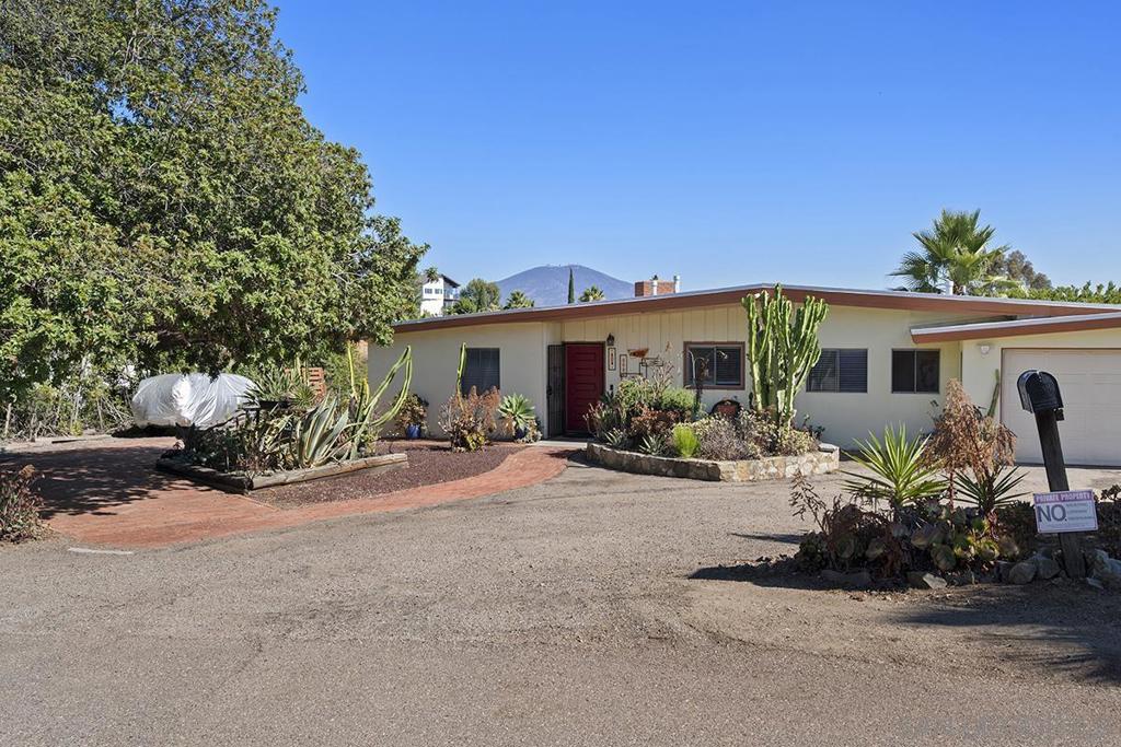 Mid-Century Gem in Mt Helix! This single level home is situated on a huge and level lot with expansive southern views, great street and paid Solar with a New Roof! Check out the gated and large side yard, perfect for your pool or private ADU and it has a Transfer Switch ready for a generator with natural gas should power go out. The property features updated bathrooms, cozy fireplace and an amazing, covered patio to celebrate indoor/outdoor living! Property also features a renovated full bathroom for easy guest access off the patio area and is prepped for an outdoor shower. Plenty of parking for your toys, RV's or car collection with a gated entrance as well as plenty of parking on the opposite side of the property. To top it off, the 2-car garage is oversized, perfect for 2 cars, motorcycle and a sizeable work area. This is the perfect house that's finally come on the market!