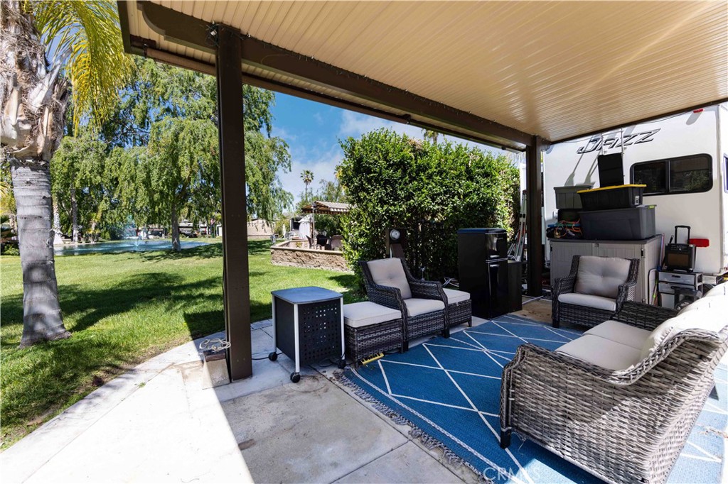 Pond Views
Welcome to this beautifully maintained lot located in a quiet neighborhood of Rancho California RV Resort. Lot 41 offers an Alumawood structure with sunshades covering the living space. In the kitchen area you’ll find a great BBQ area and stone firepit, with plenty of space to entertain your family and friends. Located close to the Market and a heated pool with a hot tub which you can enjoy after a round of golf.
The resort is guard gated with no age restrictions. Monthly HOA fee includes unlimited golf for owners, trash pickup at your lot, water/sewer, and common area maintenance.
If you are considering a premier Southern California RV destination, don't miss out on visiting Rancho California RV Resort. Make this your paradise get-away.