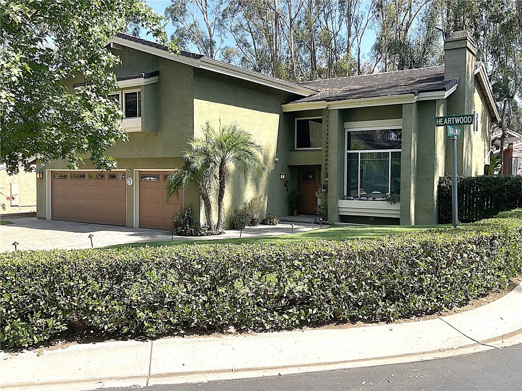 Welcome to Heartwood – Unique, Elegant, Fully Remodeled, and Move-In Ready!
This stunning 4-bedroom, 2.5-bath home offers 2,728 sq. ft. of living space on a 7,000 sq. ft. lot with a 3-car garage and an entertainer’s dream backyard. A spacious bonus room is currently used as an office but can easily be converted to a 4th or 5th bedroom.
From the moment you arrive, the quality craftsmanship is evident — newer windows and doors throughout, a custom front entry door, and a welcoming foyer with handcrafted tile flooring. The custom quarter-sawn oak staircase sets the tone for the elegance inside.
The living and dining rooms feature Brazilian rosewood flooring, expansive windows, and French doors leading to the beautifully landscaped yard with an outdoor kitchen. Both the living and family rooms have a handcrafted tile fireplaces with custom wood mantels.
The chef’s kitchen has been fully remodeled with Alder wood cabinets, granite counters, a custom backsplash, and high-end appliances including a Wolf 5-burner gas cooktop and Bosch double oven. The inviting breakfast counter opens to the comfortable and spacious family room, creating a great warm room space with direct backyard access.
Upstairs, the massive primary suite impresses with a beamed, vaulted ceiling, custom Alder wood closet doors, and a luxurious bath featuring a stone walk-in shower with glass enclosure, vintage soaking tub, dual granite-topped vanities, and custom mirrors and lighting. The secondary bedrooms are spacious, with a fully remodeled hall bath. Solid core Alder wood doors complete the upstairs.
The backyard retreat is designed for year-round enjoyment: a pavilion with recessed lighting, ceiling fan, and TV; lush landscaping with vibrant plants and flowers; a custom waterfall, artificial turf, above-ground spa, and two BBQs. Pavers flow throughout the backyard, driveway, and entryway, adding beauty and ease of maintenance.
Additional upgrades: See supplements for the complete list. Click the photo tour to appreciate every detail!