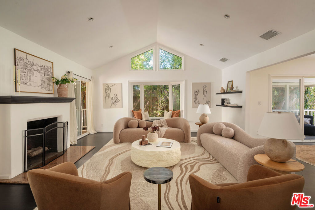 Tucked above the iconic Sunset Strip, this Mediterranean-style retreat welcomes you with a charming courtyard entry and timeless character. A spacious open-concept kitchen anchors the main level, ideal for both everyday living and entertaining. A versatile guest bedroom doubles as a home office, while the lower level offers three en-suite bedrooms each opening to a private balcony overlooking the tranquil backyard. The primary suite is a true sanctuary, complete with dual bathrooms and a generous walk-in closet. The home's seamless indoor-outdoor flow, lush surroundings, and thoughtful layout create a warm and inviting atmospherecome check it out!