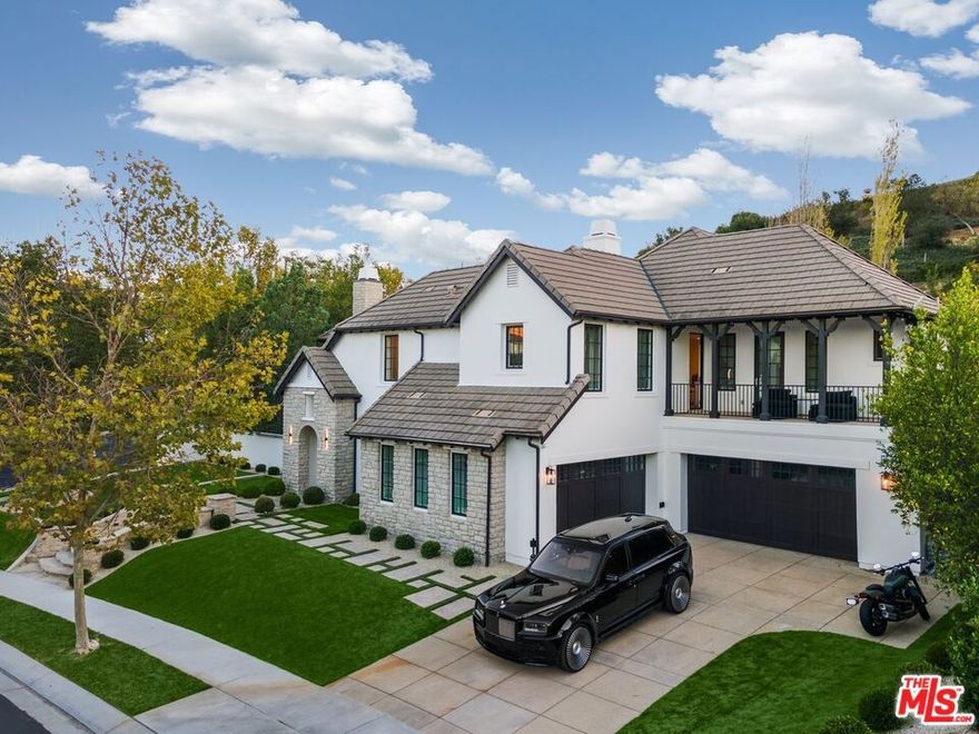 Experience the best of Calabasas' gated communities - The Oaks. This sprawling almost half acre estate is masterfully designed to enjoy the SoCal indoor/ outdoor lifestyle. The 6745 sf spacious interior is stylishly designed with state of the art lighting & offering the perfect combination of both plentiful space for gathering & tranquility. From its grand Wow Factor entry with 20 ft high ceilings to the modern sleek designed dining room, the floorplan accentuates your lifestyle. One main level Ensuite opens to the inviting backyard. The well thought out designer kitchen has custom features with top-of-the-line appliances designed for those who love to cook & entertain. Definitely the homes gathering spot with the eat in dining area & open family room with fireplace that opens to the great outdoors. Plentiful covered patio space for outdoor dining/ entertaining/ mediative mornings. Downstairs also boasts a charming theater conveniently located just off the kitchen. Upstairs possesses the large Primary Ensuite with dual vanities, dual closets, balcony, & sizeable space for dual offices, a massage room, more closet space, or gym. The other Ensuite bedrooms upstairs surround their own private living room just off the back staircase & has its own balcony. Great for spend the night parties, relaxing with friends, guest/ family to have their own space. Throughout this home the floorplan offers numerous openings to bring in the outdoors from the dining room, family room, kitchen, & eat in dining area. Outdoors there's two BBQ areas -  one just off the kitchen & the other sunken to pool level intended for swim up dining/ entraining. Bose 360 surround sound system throughout. Plus a basketball shooting area tucked away on the side of the home. All this & minutes from the community center up to date full gym, a recreation center, a lap pool, tennis/ basketball/ pickleball courts, parks & trails. And a short drive to The Commons with restaurants, shopping, & theater. Close by you can enjoy Malibu beaches, top notch golfing, Calabasas Country Club, & award-winning schools. Come & see for yourself The Oaks experience. Seller offering below market financing!