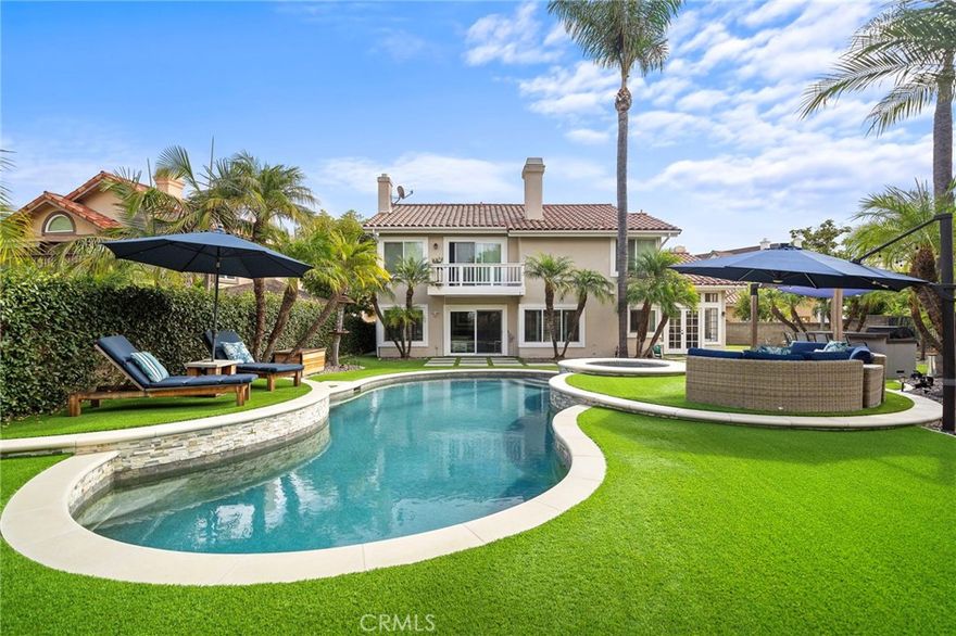 Welcome to 28811 Greenacres – a luxurious entertainer’s dream tucked away on an expansive cul-de-sac lot in the prestigious guard-gated community of Canyon Crest Estates. From the moment you step through the front door, you’ll be greeted by a dramatic sweeping staircase, soaring cathedral ceilings, and walls of windows that bathe the interior in natural light.

The grand entry features travertine flooring that flows into elegant living and dining spaces, complemented by rich wood floors. The heart of the home is a recently remodeled chef’s kitchen featuring an oversized island with seating for six, sleek quartz countertops, custom shaker cabinetry, and top-of-the-line stainless steel appliances.

The open-concept design connects the kitchen to the spacious family room and resort-style backyard—complete with new landscaping, low-maintenance turf, a built-in BBQ island, new PebbleTec pool and spa with updated equipment, a putting green and sand pit, and multiple lounging areas ideal for entertaining or soaking up the sun. Enjoy incredible views of Mission Viejo's 4th of July fireworks from your own private oasis!

A main-floor bedroom and adjacent beautifully remodeled full bath with step-in shower offers privacy and convenience. Upstairs, the expansive primary suite is a true retreat with a cozy fireplace, private balcony with serene views, and a spa-inspired bath featuring a soaking tub, separate shower, and dual vanities with granite counters. The oversized bonus room (optional 5th bedroom) includes a walk-in closet and offers endless possibilities as a media room, home office, or gym.



Additional upgrades include PEX plumbing throughout, brand new carpet upstairs, recessed lighting, a 3-car garage with epoxy flooring, and so much more. Enjoy all the amenities Canyon Crest has to offer—24/7 guard gated security, a clubhouse with tennis and pickleball courts, Olympic-sized pools, a fitness center, and year-round community events.



Don’t miss this rare opportunity to own a show-stopping home in one of Mission Viejo’s most sought-after neighborhoods!