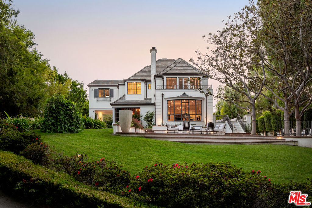 Indulge in timeless elegance at this distinguished Holmby Hills estate, gracefully set on approximately 1.70 acres of lush land. A long, private drive leads to serene surroundings, including a secluded park, expansive grassy lawns, vibrant gardens, and meandering walking paths that envelop this captivating residence.Entertain effortlessly in the grand formal dining room, spacious living room, stately library, sophisticated bar, and indulgent eat-in chef's kitchenor step outside to expansive terraces, a magnificent pool, and a generous patio, all seamlessly connected by elegant French doors throughout.Retreat to luxurious bedrooms and spa-inspired baths, each appointed with the finest finishes and meticulous attention to detail.Crafted with exquisite crown moldings, graceful arches, a sweeping staircase, rich mahogany floors, and pristine marble, this home has hosted some of Hollywood's most refined and glamorous gatherings.Experience the essence of Old Hollywood sophisticationwhere timeless architecture, impeccable craftsmanship, and iconic prestige meet in one unforgettable masterpiece.