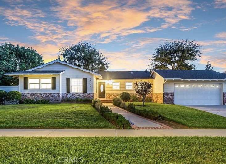 Welcome to this stunningly updated single-story home in Porter Ranch! The bright living room with a cozy fireplace flows into the formal dining area with a custom pantry, while the modern kitchen showcases quartz countertops and newer appliances. Throughout the home, you’ll find luxury vinyl flooring, recessed lighting, designer finishes, dual-pane windows, plantation shutters, Nest smart features, and fresh interior paint. Offering 4 bedrooms plus a versatile bonus 5th room with an extra bath (garage conversion), this home sits on a spacious 10,000+ sq. ft. lot with a serene backyard featuring covered patios, mature trees, and a park-like feel. Ideally located across from Darby Ave Elementary and within the sought-after Granada Hills Charter High School district. Experience the comfort and elegance of this Porter Ranch gem!