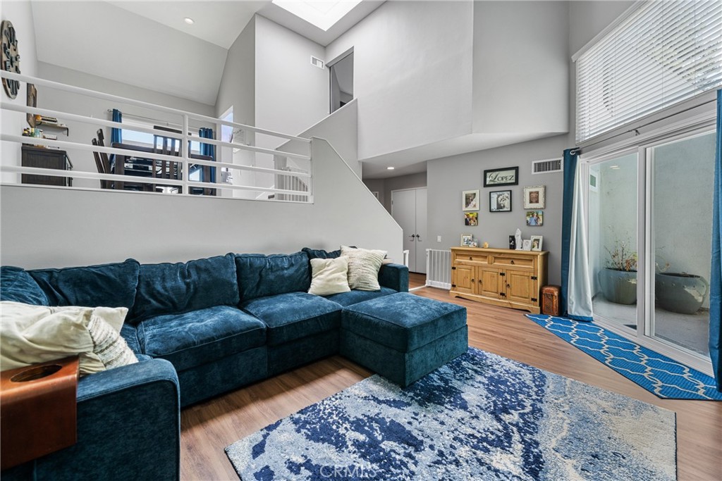 Open House Saturday from 1-5pm!! Beautiful updated 2-bedroom condo located in the Villeurbanne Community! Upon entering you will notice the natural lighting that flows through the home. All newer Dual Pane windows and sliders installed in 2023! Vinyl plank flooring throughout, the living room, kitchen and upstairs bedroom. The vaulted ceilings make this home feel so spacious and open, spread out over 1,250 square feet! Cozy up in the family room to your gas burning fireplace. The kitchen was recently updated with stainless appliances, stunning white shaker cabinets, quartz countertops, and subway backsplash. Enjoy grilling outside, dining al fresco on your balcony just off the kitchen. Both bathrooms have been tastefully updated with matching vanity cabinets along with quartz countertops. Newer AC and Furnace installed in 2023 along with a tankless water heater! In addition, a soft water system was installed as well! Laundry is located on the lower level next to the Primary suite. Two car garage is attached with direct access to the main living area. Access to 2 community pools and spas. Located just minutes from Irvine Regional Park, hiking and biking trails, Santiago Canyon College, Chapman University, and top-rated schools. Water and trash are included in the HOA! Do not miss out on this amazing home!