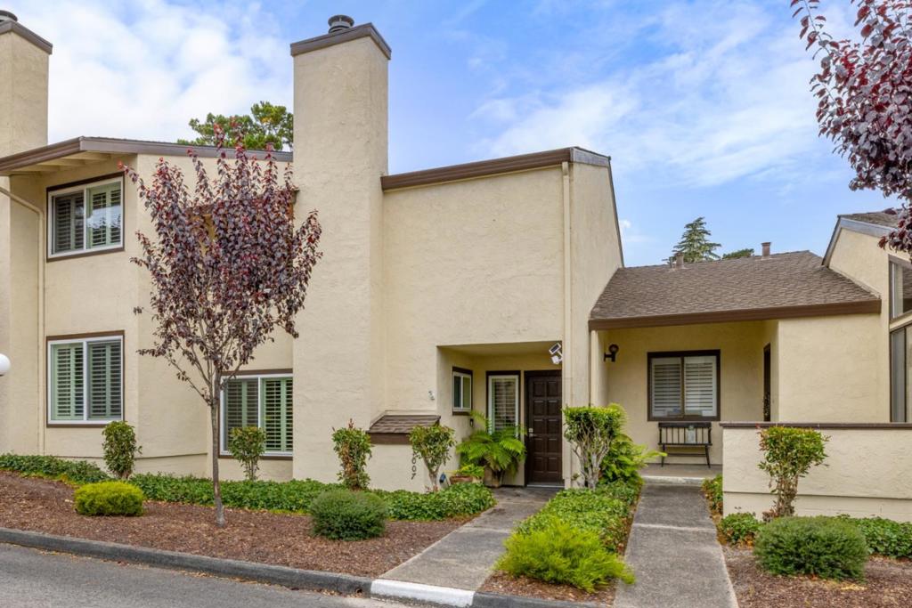 Nestled among majestic oaks in a prime Pacific Grove location, this exceptional 3 bed 2.5 bath condo - featuring all 3 bedrooms and 2 full baths upstairs with a convenient half bath on the main level - offers a rare blend of luxury, comfort, and convenience, just a short walk to Asilomar Beach and Spanish Bay. Every detail has been thoughtfully curated with high-end finishes and custom upgrades. The chefs kitchen boasts a new Wolf range, Sub-Zero refrigerator, Miele appliances, Italian cabinetry, quartz countertops, and a reverse osmosis water filtration system. Dual-paned windows with plantation shutters, custom doors, engineered wood floors, and newer bedroom carpet add to the elegance. Modern amenities include recessed lighting, Bose speakers, and a Nest thermostat for remote climate control. The private patio is a retreat with modern concrete, built-in fire pit, and fountain, ideal for relaxing or entertaining. Ample storage by California Closets, including a built-in wine rack. Finished 2 car garage with extra storage.This is a rare turnkey opportunity in one of the Peninsulas most desirable coastal settings.