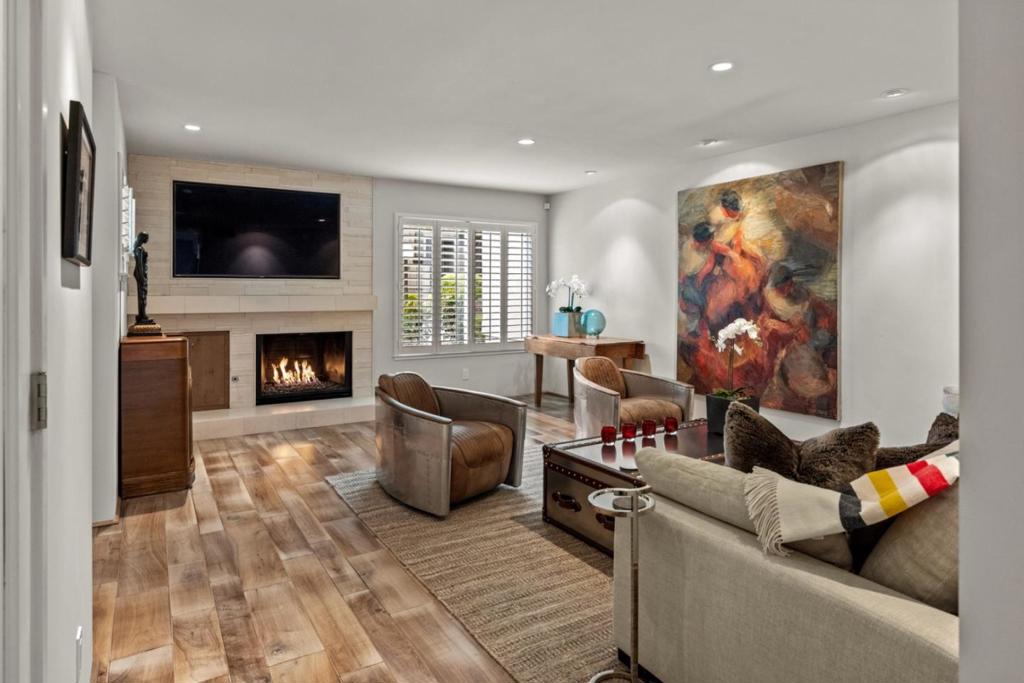 Nestled among majestic oaks in a prime Pacific Grove location, this exceptional 3 bed 2.5 bath condo - featuring all 3 bedrooms and 2 full baths upstairs with a convenient half bath on the main level - offers a rare blend of luxury, comfort, and convenience, just a short walk to Asilomar Beach and Spanish Bay. Every detail has been thoughtfully curated with high-end finishes and custom upgrades. The chefs kitchen boasts a new Wolf range, Sub-Zero refrigerator, Miele appliances, Italian cabinetry, quartz countertops, and a reverse osmosis water filtration system. Dual-paned windows with plantation shutters, custom doors, engineered wood floors, and newer bedroom carpet add to the elegance. Modern amenities include recessed lighting, Bose speakers, and a Nest thermostat for remote climate control. The private patio is a retreat with modern concrete, built-in fire pit, and fountain, ideal for relaxing or entertaining. Ample storage by California Closets, including a built-in wine rack. Finished 2 car garage with extra storage.This is a rare turnkey opportunity in one of the Peninsulas most desirable coastal settings.
