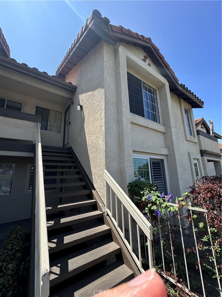 Don’t miss this bright and airy single-level upper unit in the desirable Las Palmas community of Mission Viejo, offering unobstructed panoramic views. The open floor plan showcases vaulted ceilings, new luxury vinyl plank flooring throughout, and two primary bedrooms, each with its own full ensuite bathroom. Relax on the spacious balcony, which along with the large main living areas, takes full advantage of the sweeping views. Additional highlights include inside laundry with washer and dryer included, included fridge, air conditioning, a covered carport with storage plus an extra parking space, and community pools. Water and trash are included, and residents have the option for membership at Lake Mission Viejo for a small monthly fee, where thery can enjoy the beach, clubhouse, rental boats, concerts, fireworks, and more.