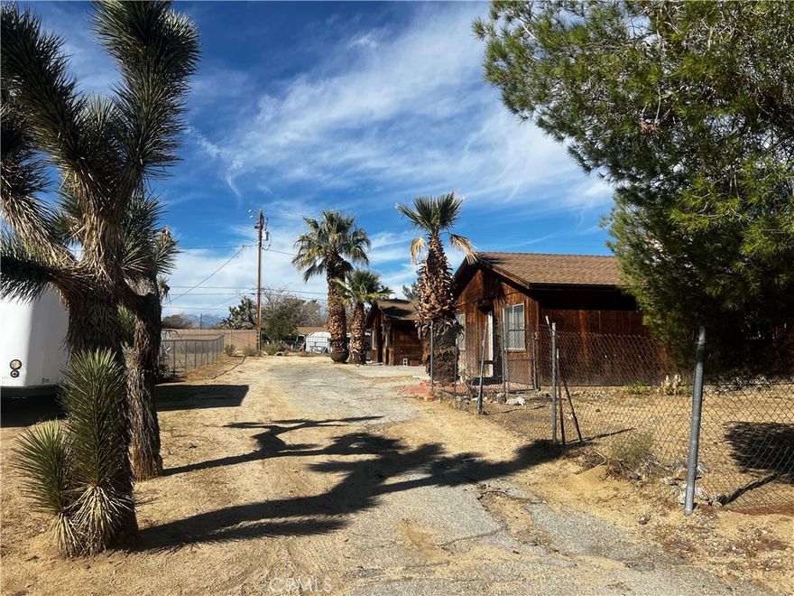 This Yucca Valley duplex offers a great investment opportunity with both units currently vacant—set your own rent rates from day one. Each unit features 2 Bedrooms and 1 Bathroom, indoor laundry areas off the kitchen with both electric and gas dryer hookups, along with garage access (one unit has a 2-car garage and the other a 1-car). One unit has been remodeled with fresh interior paint, tile flooring, updated cabinetry, and epoxy countertops. The second unit is about 90% complete and just needs a light makeover—paint and flooring will go a long way. The owner will be finishing the updates over the next few weeks, including a new gas oven and fresh paint. Both units have separate solar systems, providing energy efficiency and long-term value. This property offers solid rental potential, versatility, and plenty of upside for an investor or owner-occupant looking to maximize returns.