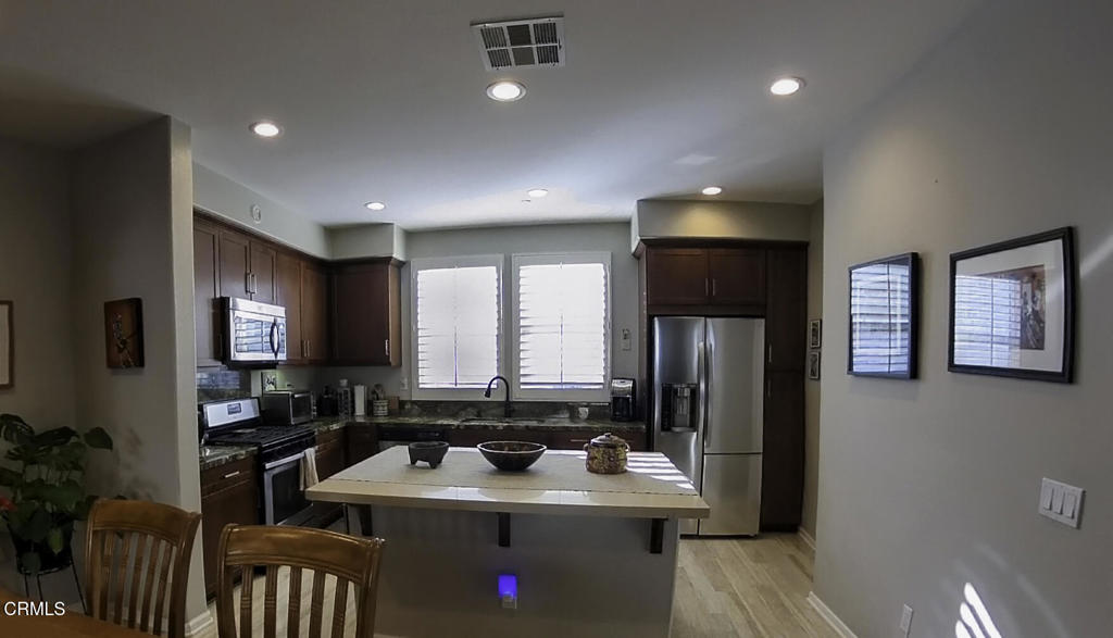 xperience coastal living at its finest in this stunning tri-level townhome located in The Westerlies community of West Oxnard, just moments from the Channel Islands Marina and beautiful local beaches. This spacious 3-bedroom, 3.5-bath residence offers an open-concept floor plan with abundant natural light, high-end finishes, and over $50,000 in thoughtful upgrades.Enjoy luxury vinyl plank flooring throughout, granite and Caesarstone countertops, stainless steel appliances, plantation shutters, recessed lighting, and built-in surround sound. Each bedroom features an en-suite bath for added privacy and comfort, including a spacious primary suite with a large walk-in closet. Additional highlights include a walk-in pantry, upgraded cabinetry, rain-glass shower enclosures, and direct access to a two-car garage with extra storage.Relax on the private front patio or stroll through the community's beautifully maintained park and playground. With low HOA fees and a serene setting just minutes from dining, shopping, and harbor activities, this home combines modern elegance with the relaxed coastal lifestyle Oxnard is known for.