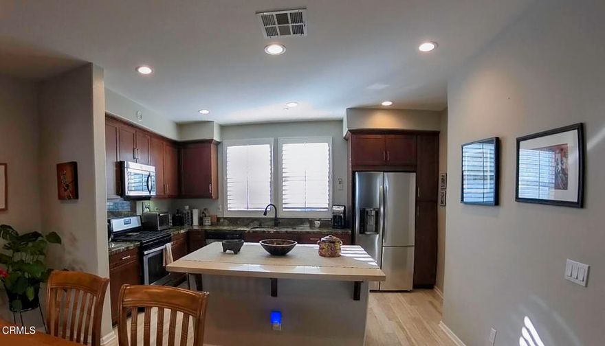 xperience coastal living at its finest in this stunning tri-level townhome located in The Westerlies community of West Oxnard, just moments from the Channel Islands Marina and beautiful local beaches. This spacious 3-bedroom, 3.5-bath residence offers an open-concept floor plan with abundant natural light, high-end finishes, and over $50,000 in thoughtful upgrades.Enjoy luxury vinyl plank flooring throughout, granite and Caesarstone countertops, stainless steel appliances, plantation shutters, recessed lighting, and built-in surround sound. Each bedroom features an en-suite bath for added privacy and comfort, including a spacious primary suite with a large walk-in closet. Additional highlights include a walk-in pantry, upgraded cabinetry, rain-glass shower enclosures, and direct access to a two-car garage with extra storage.Relax on the private front patio or stroll through the community's beautifully maintained park and playground. With low HOA fees and a serene setting just minutes from dining, shopping, and harbor activities, this home combines modern elegance with the relaxed coastal lifestyle Oxnard is known for.