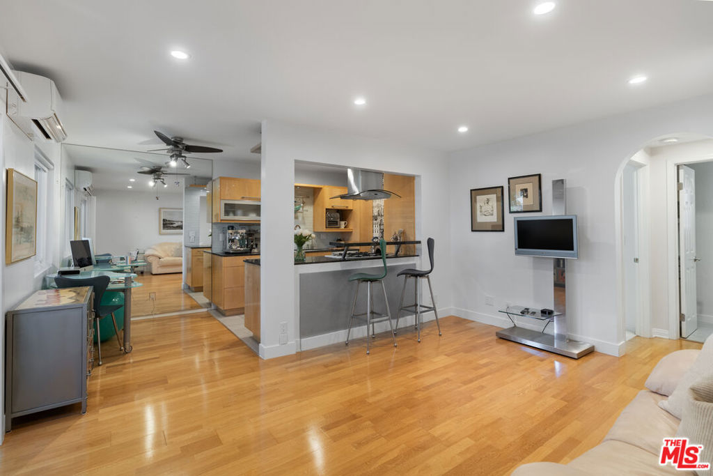 Beautifully upgraded 1 bedroom, 1 bathroom condo in the heart of Sunset Park, Santa Monica. This unit features real oak hardwood floors, an open floor plan, recessed LED can lighting, and Casablanca & Harbor Cove ceiling fans. Mitsubishi split A/C and heating unit ensures year-round comfort. The chef's kitchen boasts Jen Air stainless steel appliances, including a self-cleaning convection oven, soft-close Blum European cabinetry, and beautiful countertops. A Water Glove H2O filter adds purity and convenience. The bedroom features custom closets with cedar backing and built-in drawers, plus a spacious linen closet. The remodeled bath includes dual sinks, a glass shower enclosure, Hans Grohe handheld shower head, and a built-in bench. Modern upgrades include GFCI outlets with duplex USB ports, electronic one-way blinds by The Shade Co., California Deluxe double-pane windows and sliders, and lever-style doors throughout. Other amenities: fiber internet, a full security system, secured gated parking with a dedicated storage unit, and access to a shared community roof deck patio with seating to enjoy ocean breezes. HOA dues include water, trash, and common area maintenance. Located just minutes from the beach, coffee shops, restaurants, grocery stores, and all that Santa Monica has to offer. A rare opportunity to own a private gem of a home in one of LA's most desirable coastal neighborhoods.