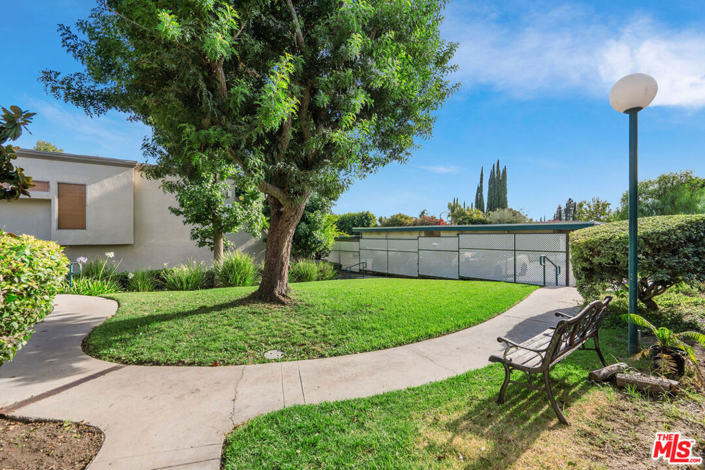 Welcome to a warm and inviting lifestyle in the heart of Northridge, where comfort meets convenience in this beautifully updated two-story townhouse. Nestled within the gated Peppertree community, you'll enjoy secure living and resort-style amenities including a sparkling pool, relaxing spa, and tennis courts, perfect for unwinding or staying active close to home. Just outside your front door, a serene grassy courtyard offers a peaceful welcome and a perfect spot to enjoy a cup of coffee or chat with neighbors. And just beyond the pool and tennis courts, you'll find an expansive, park-like grassy area, ideal for soaking up the sun, stretching out with a good book, or giving your pup space to run and play. Inside, the home is bright and welcoming, with natural light filling the open-concept living space. A private patio offers a perfect retreat for outdoor dining or weekend gatherings. The remodeled kitchen (2023) features modern finishes and flows easily to the dining area. Conveniently located on the main level is a powder room with a laundry closet, designed for everyday functionality and ease. Upstairs, all three bedrooms offer peaceful retreats with abundant sunlight and practical closet space. The primary suite features its own private bath, while the second full bathroom is located just down the hall from both secondary bedrooms. All 3 Bathrooms were remodeled in 2023! Fresh interior paint, new carpeting, updated light fixtures, and stylish window treatments throughout give the home a clean, move-in ready feel. With a new HVAC system installed in 2023, plus included washer and dryer, refrigerator, stove and microwave, this home offers both comfort and value. Enjoy two parking spots, one covered and one uncovered, and a location just minutes from CSUN, shopping, dining, and entertainment. This is more than just a place to live, it's a place to feel at home.