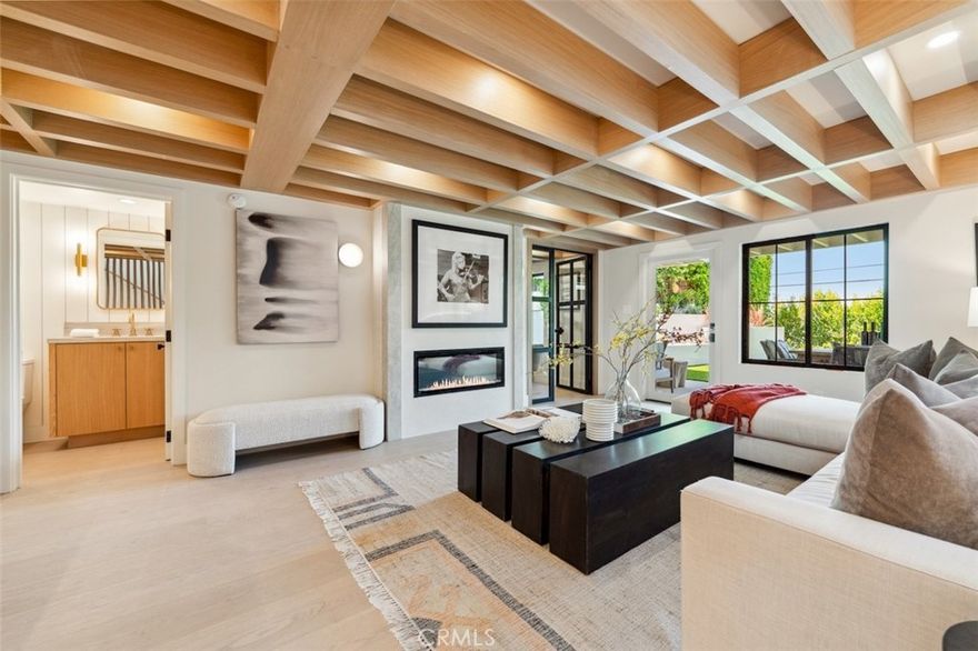 New!!! Experience elevated living in this beautifully reimagined custom home, ideally located South of the Boulevard in one of Sherman Oaks’ most coveted neighborhoods—walking distance to Ventura Blvd’s top restaurants, boutiques, and cafes. Meticulously remodeled with a focus on natural, organic design, this light-filled sanctuary features an airy open floor plan with vaulted white oak ceilings, expansive sliding glass doors, and serene tree-dappled views. The chef’s kitchen is a showstopper, showcasing Taj Mahal natural stone countertops, Thermador appliances, custom white oak cabinetry, and European white oak floors throughout. Indoor-outdoor flow is seamless, opening to perched balcony and a lush backyard with a covered patio—ideal for entertaining or quiet relaxation with room for an infinity pool to complete the outdoor oasis. A rare blend of high-end craftsmanship, tranquility, and walkability in prime Sherman Oaks.