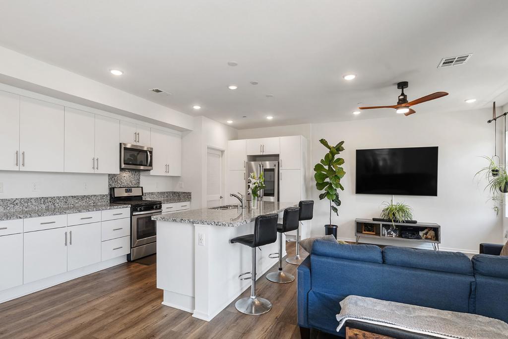 Welcome to your dream end unit in the peaceful and sought after community of Playa del Sol! With 1,709 square feet of thoughtfully designed living space across three levels, this beautifully maintained residence offers the perfect mix of luxury, low-maintenance living, and modern comfort. Step inside to find a versatile bonus room on the entry level—currently soundproofed and ideal as a private office, podcast studio, or creative hideaway. Upstairs, the main level steals the show. The expansive chef’s kitchen features an oversized island, stainless steel appliances, and a wealth of cabinet space—perfect for whipping up gourmet meals or hosting happy hour. The light-filled dining area and inviting family room complete the open-concept layout, making this floor the heart of the home. A spacious laundry area (with serious storage) and a stylish powder room round out the level. Head upstairs and you'll find three well-appointed bedrooms with newer carpet, including a serene primary suite—perfect for winding down after a long day. A detached two-car garage, resort-style amenities including a sparkling community pool, and a prime location near parks, shopping, schools, and major freeways round out the perks. This home checks every box—style, function, and location. Don’t miss your chance to make it yours! The 2 secondary bedrooms upstairs have been virtually "emptied" and "restaged", in addition to including the actual room shot as is. All three pictures for each of those 2 rooms is included in the photos.