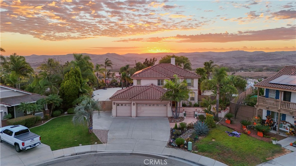 Where privacy, views, and location meet unmatched livability, welcome to 5450 Alexandrine Court. Tucked away at the end of a peaceful cul-de-sac in one of Oceanside’s most sought-after neighborhoods, this home sits on nearly half an acre, offering rare space and seclusion. The open and light filled floor plan features four spacious bedrooms and three full bathrooms designed for comfort, flexibility, and effortless entertaining. Multiple living areas allow for work, relaxation, or hosting with ease. Step outside to an incredible backyard retreat designed for everyday enjoyment and memorable gatherings complete with a full outdoor kitchen, spa, fire pit, multiple covered seating areas, and room for recreation or a basketball court. The elevated setting provides panoramic views and a sense of privacy that’s truly exceptional. With ample usable land, there’s even potential to add an ADU, offering versatility for extended living or future rental income. The oversized three car garage provides generous storage and workspace options. Ideally situated between Orange County and San Diego, this home combines tranquility with convenience minutes from Camp Pendleton, local beaches, trails, dining, and shopping. 5450 Alexandrine Court where panoramic views, privacy, and possibility define Southern California living!