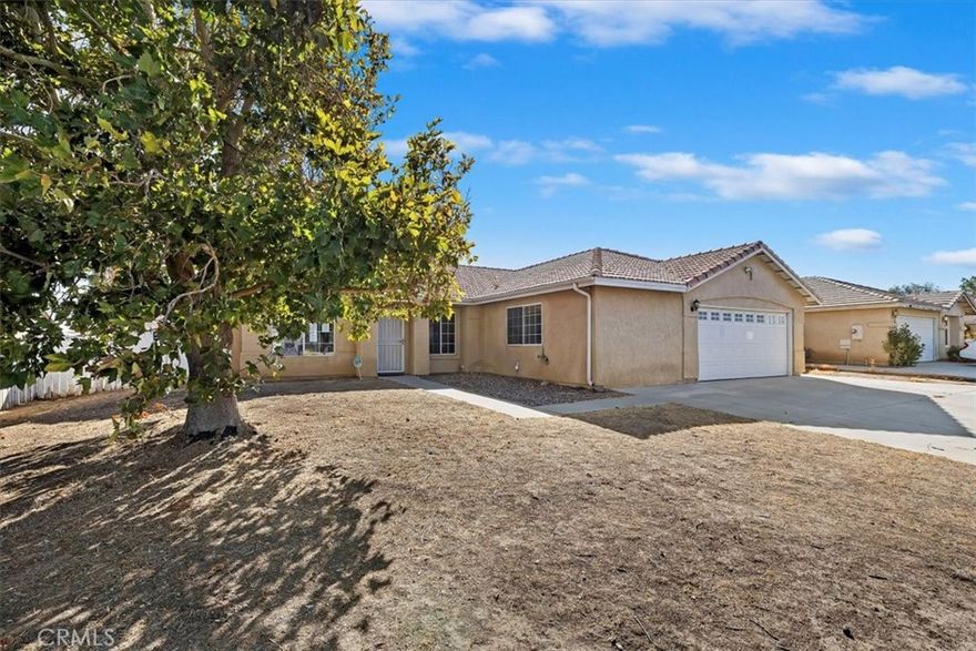 Welcome to 12411 Petaluma Rd. Victorville CA. Imagine coming home where comfort and peace of mind come together. This home is in a perfect setting for both everyday living and unforgettable moments. This thoughtfully designed 4-bedroom, 2-bathroom home offers 1,526 sq ft of inviting space on an expansive 7900 sq ft lot. Built in 1994, it features nice sized back yard. This home, welcomes you with a cozy fireplace, in the living room/formal dining area while the kitchen impresses with tile floors, a breakfast bar and plenty of cabinets. with lots of room.  The indoor laundry room included adds convenience to your daily routine, making chores feel effortless. The nice sized primary suite with a walk-in closet, ceiling fan, private bath area for your own private escape. Additional highlights include a 2-car attached garage, tile roof, and a fenced backyard. Just minutes from I-15, the Victor Valley mall and restaurant this home combines peaceful living with commuter convenience. Ready for you to move in and full of charm, this is your opportunity to own a truly special home in the High Desert.