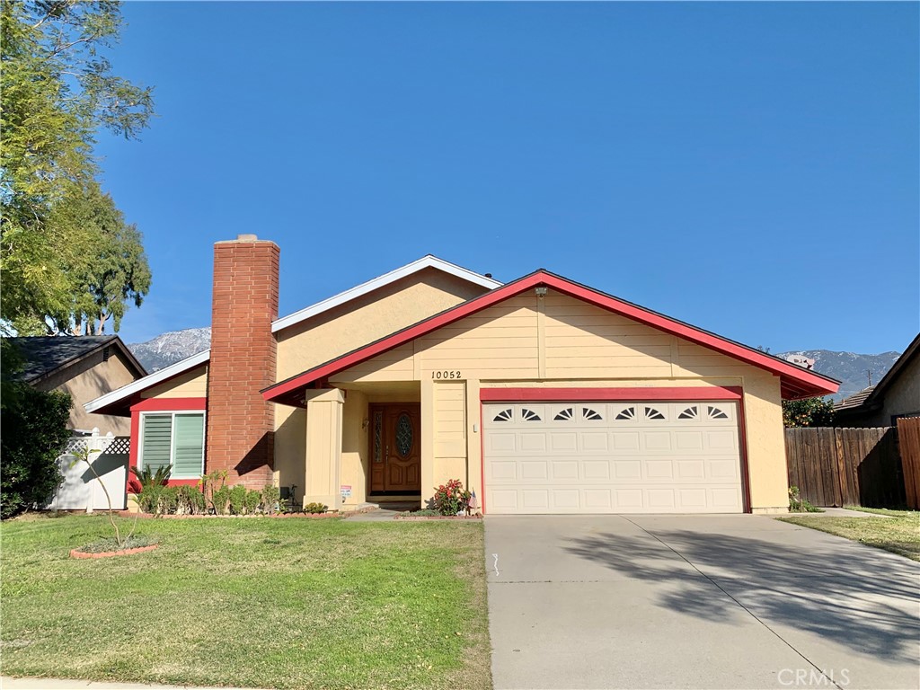 Beautiful ONE STORY single house, 4 bedroom, 2 bathrooms, 2 car garage. House features open floor plan, tiles at entrance, spacious family room, wood shutters, newer cabinets, newer granite countertop in kitchen, built in gas burner, electric oven. Laminated flooring in family room and all bedrooms, no carpet. Enclosed patio as a bonus room, and huge back yard with plenty fruit trees to enjoy. Come check this beautiful house!