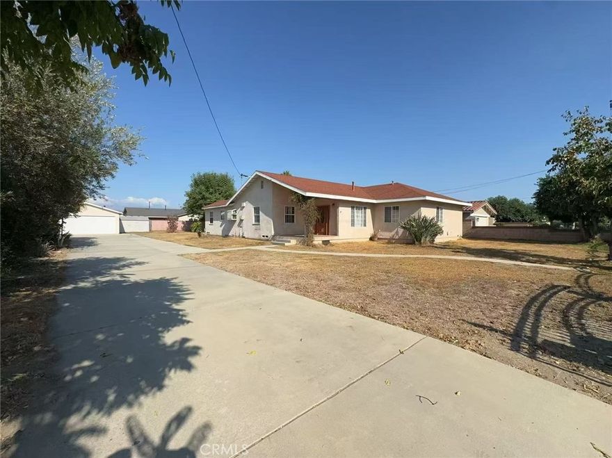 This rare one-story home offers nearly 2,000 sq ft of living space with 4 bedrooms, including a master suite with bath and walk-in closet, plus a home office. The open floor plan features laminate floors, a cozy fireplace, dual-pane windows, and a tankless water heater. Enjoy the backyard with a covered patioi, and multiple fruit trees (orange, lemon, avocado, apricot, grapefruit, olive). The large lot includes extra parking and a detached 2-car garage. Conveniently located near Kaiser, shopping, schools, the 10 Freeway, and just 20 minutes to Downtown LA.