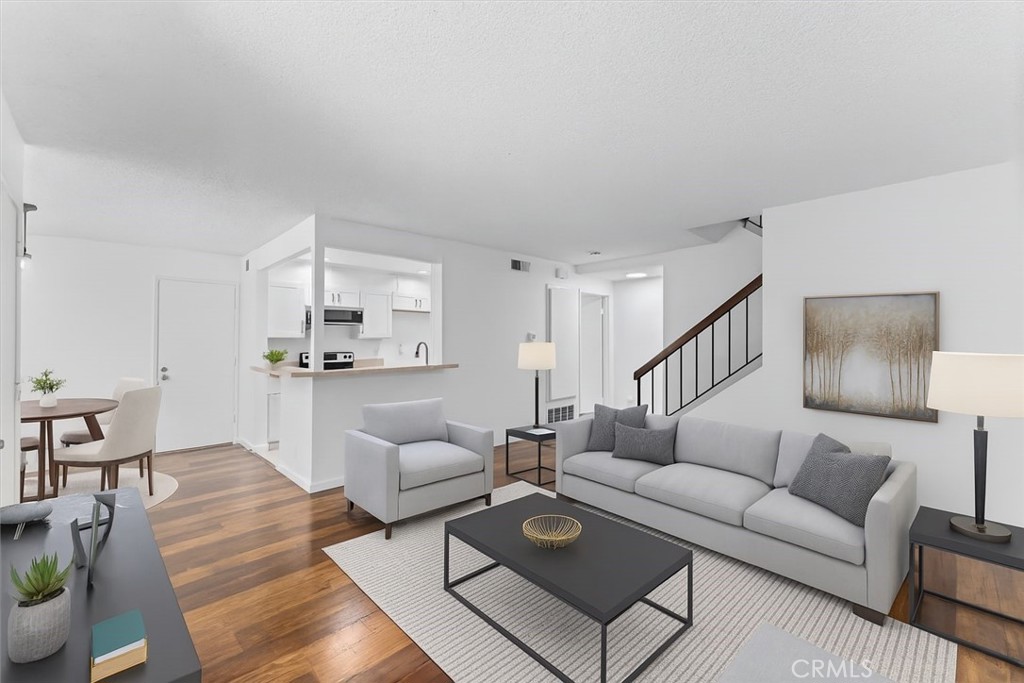 Welcome to 8024 Woodland Ave – a move-in ready gem in the heart of Buena Park! This beautifully updated 2 bedroom, 1.5 bathroom condo combines modern comfort with unbeatable convenience. In 2021, the seller completed a series of thoughtful upgrades including new flooring, sleek countertops, dual-pane windows, fresh interior paint, a new furnace, new HVAC system, bathroom remodel, new water heater, and new garage motor – ensuring a worry-free lifestyle from day one. The spacious, light-filled layout includes an inviting living area and a well-equipped kitchen perfect for daily living or entertaining.
Enjoy the added bonus of a private 2-car enclosed garage for secure parking, extra storage, and space to hook up washer and dryer. Located just minutes from Knott’s Berry Farm, The Source OC, Porto’s Bakery, and Buena Park Downtown, with easy access to the 5 and 91 freeways, commuting and weekend plans are a breeze. Surrounded by shopping, dining, parks, and entertainment, this turnkey condo is ideal for first-time buyers, downsizers, or savvy investors. Don’t miss your chance to own in one of Buena Park’s most convenient locations!