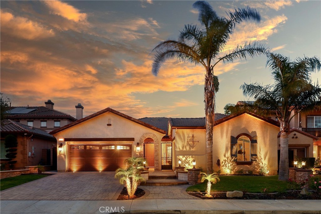 Gorgeous SINGLE-STORY luxury estate with a pool, perfectly situated on a cut-de-sac in one of the area's best locations, on a premium oversized lot in the scenic hills of Serrano Heights. You'll love coming home to this stunning BELLAGIO model, featuring over $400,000 in high-end upgrades that offer the ultimate in style and comfort. Step into the front courtyard, where a charming fountain sets the tone and invites you into a beautifully finished home filled with refined finishes and a lifestyle thoughtfully crafted to capture your heart and imagination. This 3-BR/2.5-BA home includes a custom primary suite where the original fourth bedroom was combined with the third to create an expansive suite retreat, complete with dual walk-in closets and a beautifully remodeled en-suite bath—easily converted back to a four-bedroom. The gorgeous formal living and dining rooms, complete with a butler's pantry, offer an elegant setting for everything from intimate gatherings to lavish celebrations. The family room boasts custom built-ins, a fireplace, surround sound and a striking wall of folding glass doors that highlight incredible backyard views. The show-stopping chef’s kitchen is a masterpiece in itself—equipped with Thermador stainless appliances, built-in refrigerator and wine cellar, gleaming granite counters with stone backsplash, oversized island with ice machine, walk-in pantry and breakfast nook. The luxurious master suite with double-doors, a custom walk-in closet and a spa-inspired bath featuring a jetted soaking tub, stone shower and dual vanities-an ideal space to relax and unwind. And then there’s the backyard—a spectacular outdoor paradise that must be seen to be believed. Nestled on a prized oversized lot, enjoy a resort-inspired backyard with a newly resurfaced pool, elevated spa and soothing waterfall feature. The beautifully landscaped backyard is an entertainer's dream space offering the ideal setting for outdoor dining beneath a custom-built Alumawood patio cover, built-in BBQ, fire pit and elegant paver flooring - all designed for intimate evenings or lively gatherings. Luxury extras include wide-plank wood and natural stone flooring, plantation shutters, electric window shades, crown molding, recessed lighting, fire sprinklers, newer pool equipment and a finished 3-car garage complete with built-in cabinetry and a custom stone-accented driveway. An extraordinary opportunity to own a standout property in Serrano Heights! Truly a must-see.