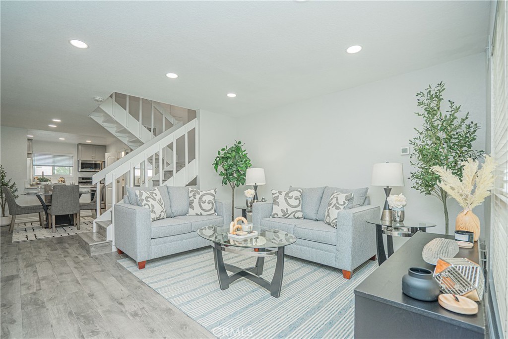 This property is a very desirable, beautiful home in the “Los Olivos” private gated community. Featured is a 2 bedroom, 1.5 bathroom town home styled condo, which includes 2 assigned parking spaces. There is no one below or above this home. The home is updated throughout the property, including the bathrooms, double paned windows and blinds, kitchen cabinets, quartz counter tops, stainless steel appliances, A/C & heat, flooring, mirrored closet doors, interior doors, recessed lights, and wall light fixtures. The refrigerator also remains for the future resident. The HOA amenities include 2 association pools, a spa, and a tennis court. HOA dues include insurance, water and trash, and all outer maintenance. The home is walking distance from the La Mirada Town Center, the post office, as well as other great neighborhood features such as shopping plazas, restaurants, grocery markets, golf courses, movie theaters, and more.