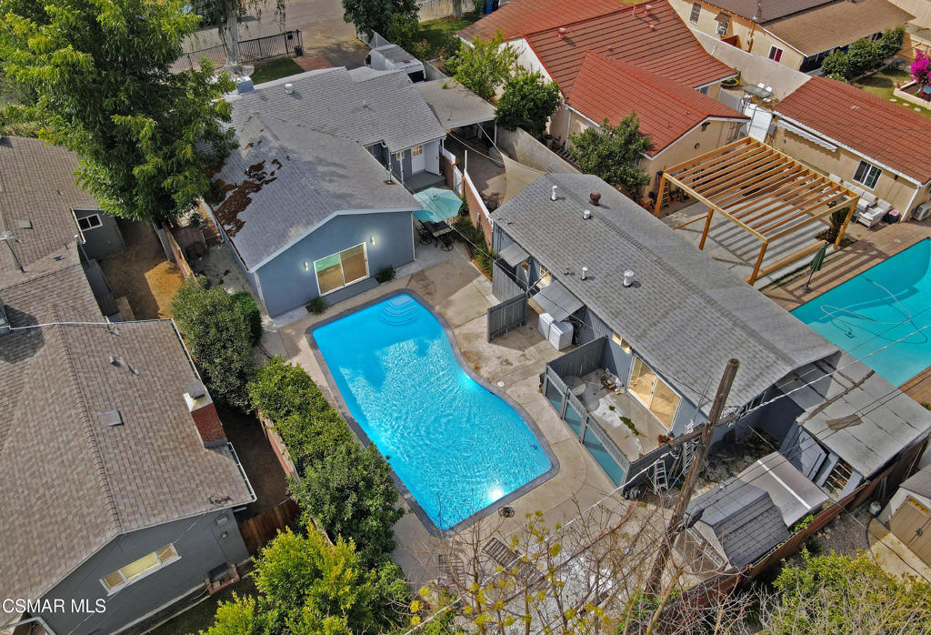 Tucked away at the end of a serene cul-de-sac, welcome to this charming 3-Bed, 2-Bath gated single-story pool home with a bonus 2 Bed 1 Bath ADU! The main residence offers 3 Bed and 2 Bath across 1,489 sq ft, while the detached ADU adds another 2 bedrooms and 1 bathroom in 768 sq ft--bringing the combined total living space to over 2,257 sq ft! Step inside the main home and you'll be greeted by a bright, welcoming interior filled with natural light. The kitchen is a dream for any home chef, featuring quartz countertops, a custom tile backsplash, stainless steel appliances, and elegant wood cabinetry. Luxury vinyl wood flooring flows seamlessly into the dining area, which is enhanced by custom wood wainscoting for added charm. Throughout the home, you'll find custom interior paint, high baseboards, crown molding, and recessed lighting--creating a polished yet cozy atmosphere. Both bathrooms have been beautifully renovated with custom tilework, modern vanities, and new flooring. The primary bedroom was included in a permitted addition and features installed plumbing, offering endless possibilities: expand into a spacious primary retreat, add a fourth bedroom, or potentially convert it into a junior ADU. In the backyard, you'll discover the separate 2-Bed, 1-Bath guest house complete with its own kitchen. Enjoy sunny California days in the expansive backyard, featuring a sparkling pool and multiple sitting areas--perfect for entertaining or relaxing.Additional highlights include central A/C and heating, dual-pane windows, a gated entry, a covered front porch, an open patio for enjoying your private backyard, and multiple storage sheds for extra flexibility. Conveniently located near shopping, parks, and freeway access--with Sherman Oaks and Studio City just minutes away--this property offers limitless potential and is truly a gem to call home! Buyer is responsible for independently verifying all permits and the accuracy of the square footage.