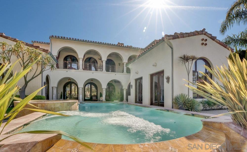 Feel like you're on a permanent vacation in this stunning custom estate located in the guard gated community of The Crosby at Rancho Santa Fe. Tucked away at the end of a quiet cul-de-sac on one of the community's most coveted flat lots, this home offers breathtaking panoramic views of the golf course. One of the very few homes with a private gated path providing direct access to the fairway. A long, secluded driveway welcomes you with a charming fountain, setting the tone for the elegance within. Inside, you'll find exquisite custom woodwork and ultra-high-end finishes throughout. The main living spaces open to spectacular views through expansive glass doors behind the family and dining rooms, blending indoor and outdoor living effortlessly. Cozy up by one of the oversized fireplaces, or entertain in style with a gourmet chef’s kitchen featuring top-of-the-line stainless steel appliances and an adjacent informal dining area. The main level also includes a generous ensuite bedroom and an impressive office that opens onto a tranquil courtyard. Upstairs, the luxurious primary retreat boasts its own private balcony with sweeping views of the entire property and golf course. An additional ensuite bedroom and a versatile loft complete the upper level. The backyard is an entertainer's paradise, showcasing a stunning architecturally designed pool that perfectly frames the custom home beyond. A separate guest house with a full bath offers comfort and privacy for visitors. To top it all off, there are two 2-car garages. Conveniently located near shopping and restaurants.