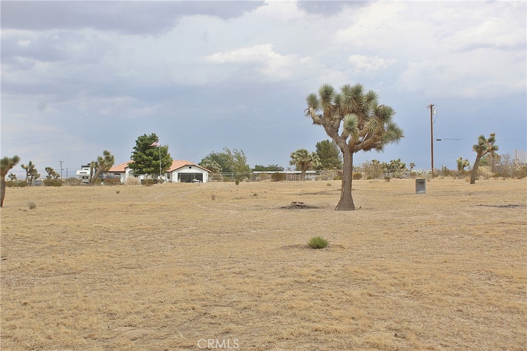 This 2.31 acre flat parcel offers the perfect canvas with wide space for your dream home, it has a water meter and electricity is available on the street. it is easy to find, is in front of in front of 12377 La Mirada Rd Phelan CA 92371. Only about 1000 feet from pavement on Duncan Rd and Wilson Ranch Rd, This piece of land is located in Phelan very close to Pinon Hills and boasts gorgeous mountains view and quiet rural setting with easy access to main roads, freeway and shopping venues. Established homes already in the area. Whether you are looking to build or hold for future potential, this property offers value and versatility in a growing area of San Bernardino County. The High Desert is now the future home of the recently approved High Speed Train from Apple Valley to Las Vegas and to the south to Rancho Cucamonga. The project is expected to break ground in the Victor Valley soon and be completed in over the course of the next few years, this projected is expected to bring in jobs and boost the economy of the High Desert.