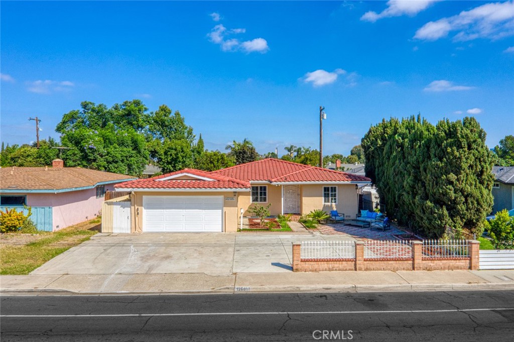 Welcome to this charming and versatile home with incredible income potential, offering 4 bedrooms, 4 full bathrooms, and 1,870 sqft of living space on a 7,200 sqft LOT. Originally 1,091 sq. ft., the home was expanded in 2017 with a permitted 800 sqft addition that is currently closed off and used as a rental featuring its own living room, entertainment room, 1 bedroom, and 2 baths—easily convertible back to one large home or kept separate for extra rental income. There’s also a 500 sq. ft. covered patio (permitted, not included in living space) for added functionality. Recent upgrades include a new clay tile roof, central A/C, dual-pane windows, LVP flooring, recessed lighting, fresh paint inside and out, and extensively updated interiors. Conveniently located near Freeway 22, Costco, Walmart, schools, churches, shopping centers, parks, hospitals, and endless dining options, this property is perfect for both comfortable living and income opportunity.