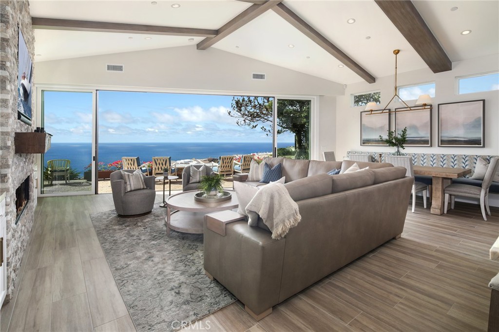 SINGLE LEVEL LUXURY LIVING OCEANSIDE OF COAST HIGHWAY! Located in the gated oceanfront community of Niguel Shores, this gorgeous single-level residence underwent a major down-to-the-studs reconstruction and expansion in 2022 and offers panoramic ocean, Catalina to San Clemente Island and incredible sunset views! The California coastal interior exudes a relaxed and casual vibe with meticulously executed high-end custom upgrades. The home features a dramatic great room/open kitchen concept, with surround sound, “distressed oak” wide-plank tile flooring, custom cabinetry and wine bar, indoor laundry room, A/C, water purification system, electric car charger and well-appointed stone finishes throughout. The gourmet kitchen showcases a stunning “Taj Mahal” quartzite slab island equipped with stainless appliances, wine chiller, pantry and coffee bar. The voluminous open living/dining room has a warm fireplace and walls of glass to enjoy the vast ocean vistas and opens to the back patio with a cozy fire pit and space to enjoy oceanfront sunsets 365 days a year! This luxury rental features 2 spacious bedrooms with 3 bathrooms including an ocean-facing master suite and en-suite bedroom with enormous walk-in closets and lavish spa-like baths. Picture windows and solar tubes bathe the spaces with natural light. Enjoy a warm shower outdoors after a dip in the ocean - just a few minutes away. Niguel Shores amenities include pool/spa, tennis/pickleball/sports courts, clubhouse, and a blufftop oceanfront park with direct access to the beaches below! Prime location! LOVE WHERE YOU LIVE! Rates vary depending on availability & season. Leased until December 2025. Leased January thru May 2026.