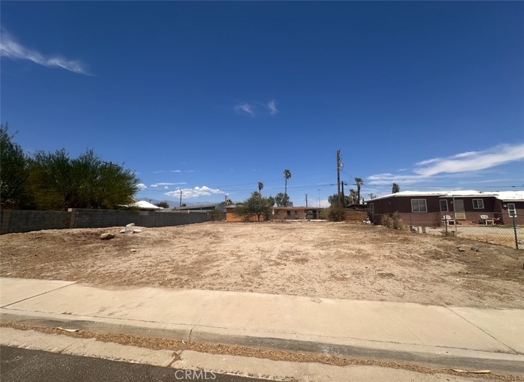 An exceptional opportunity to build your dream home on this prime vacant lot, featuring approved modern architectural plans. Grading is complete and approved by the city, a water meter is installed, house staking and property lines are marked and the property is secured with temporary fencing. Sewer approximate location is marked too. With all the heavy lifting done, this lot is truly construction-ready with approved plans and permits—ready to break ground. Enjoy a smooth start to your custom build in vibrant, ever-evolving Palm Springs destination. Plans and construction documents, permits are available for review upon request. Best panoramic views of the majestic San Jacinto Mountain.
