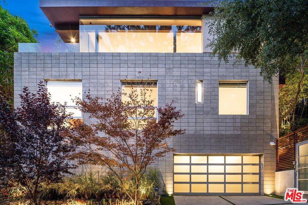 Sophisticated custom architectural hideaway, one of a kind tranquil retreat on a quiet street in Beverly Hills. Designed and built by award winning architectural firm, Tag Front (Boa, Geisha House, W, Elevate, Katana, etc). Seemless indoor, outdoor living with lots of open space, private patio and fire pit. Walls of glass with volume ceilings. Concrete and walnut wood floors. Gourmet chef's kitchen with walk in pantry. Fabulous master retreat with spacious closets. Unique finishes and attention to unique details. Meticulously maintained. Very private, quiet, and serene, yet minutes to shops, restaurants, and nightlife.