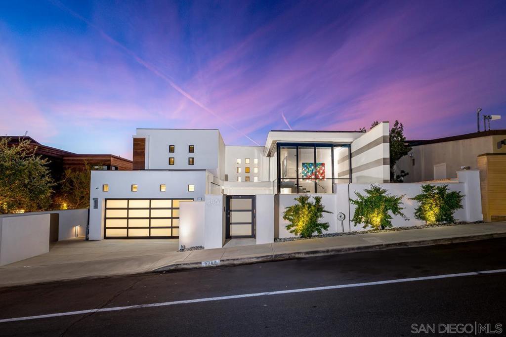 Nestled atop a picturesque coastal bluff, this unparalleled Contemporary SoCal Home offers breathtaking, uninterrupted vistas of the Pacific Ocean. Boasting an impressive 77 feet of ocean frontage, each bedroom is strategically oriented towards the sea, epitomizing the essence of indoor-outdoor living. An inviting interior courtyard pool and lounge, an ocean-facing jacuzzi, and an elevated outdoor deck embrace the coastal lifestyle. Crafted with meticulous attention to detail, bespoke furnishings infuse a beachfront ambiance, accentuated by the warmth of natural wood elements like the Live-edge Monkey Pod dining table and the unique Chamcha wood coffee table. A floating staircase, reminiscent of rolling waves, ascends within a striking two-story glass enclosure, evoking a sense of fluidity and openness throughout. Luxurious touches abound, from leather-tiled wallcoverings in one of the bedrooms to thoughtfully placed fireplaces opposite the beds, allowing for cozy evenings by the sea. Indulge in the ultimate relaxation with ocean views from the bathtubs, while the heavenly master bath envelops you in opulence with its floor-to-ceiling Calacatta marble-clad walls and integrated sinks. The Chef's Kitchen features a marble island and wet bar, complemented by a floor-to-ceiling 255-bottle glass wine display. Advanced technology includes automated lighting, shade, and sound systems, as well as ample rooftop solar panels.