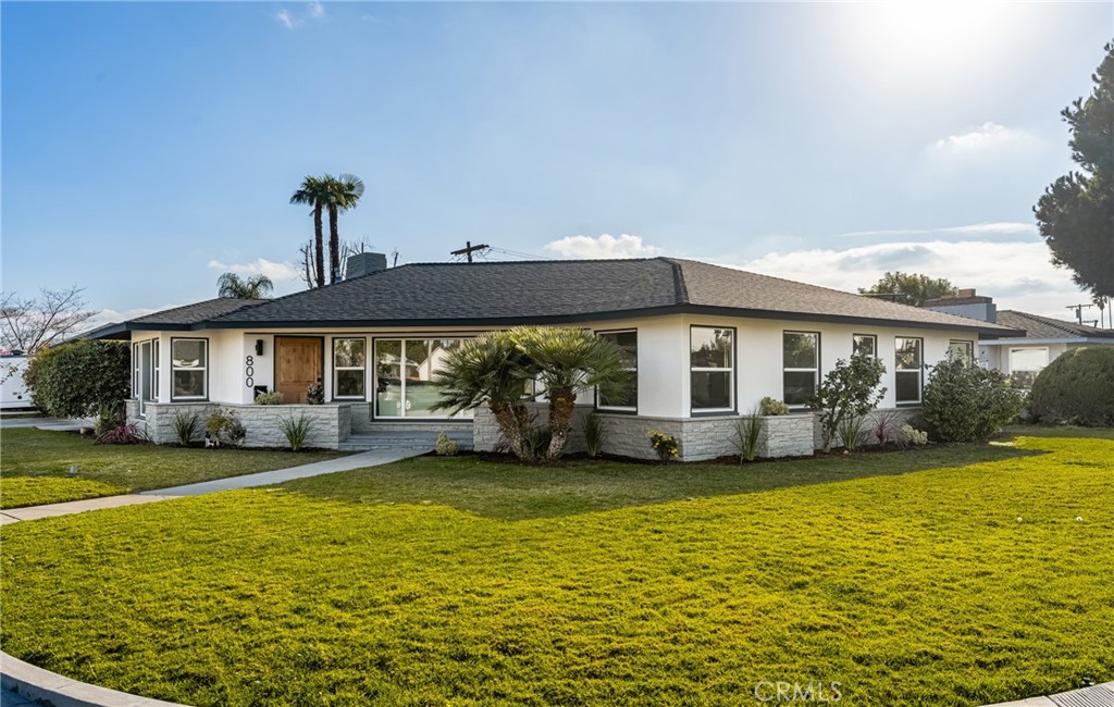 Welcome to 800 W Ken Way, a beautifully remodeled corner-lot home that exudes modern elegance and comfort. This turnkey property boasts gorgeous curb appeal and is move-in ready with countless upgrades. Step inside to discover brand-new dual-pane windows and sliders, allowing natural light to illuminate the open and airy floor plan. The home has been freshly painted inside and out, adding a crisp, modern touch. The completely remodeled kitchen is a chef’s dream, featuring sleek stainless steel appliances, stylish cabinetry, and quartz countertops. Throughout the home, recessed lighting enhances the ambiance, while luxury vinyl plank flooring adds both warmth and durability. With 4 spacious bedrooms and 3 beautifully updated bathrooms, this home offers ample space for families of all sizes. The primary suite is a true retreat, featuring a massive walk-in shower and a dual-sink vanity for ultimate convenience. The hallway bathroom also includes a dual-sink vanity, ensuring functionality and style. Escape to your private backyard oasis, where a sparkling pool awaits—perfect for relaxing and entertaining year-round. Located in a highly sought-after Anaheim neighborhood, this home is near award-winning schools, top-rated dining, shopping, and entertainment