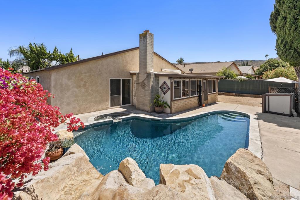 Introducing 13024 Standish Drive, a charming single-level home in Poway, now available for the first time. This property offers 5 bedrooms and 2 bathrooms, set on a generous 7,800-square-foot lot. The backyard highlights a sparkling pool with a spa and slide. Additional yard space can be used for entertaining, gardening, play, storage, or potentially an ADU. Inside, you'll find a freshly painted interior and an open kitchen equipped with granite countertops, wood cabinets, and stainless steel appliances. The enclosed sunroom offers an extension of the living space with a fireplace for added comfort. Additional features include an attached 2-car garage, RV and boat parking, a newer roof, and a covered front porch. This home is part of the Poway Unified School District and offers convenient access to local shops, dining, a farmer's market, parks, and hiking trails.