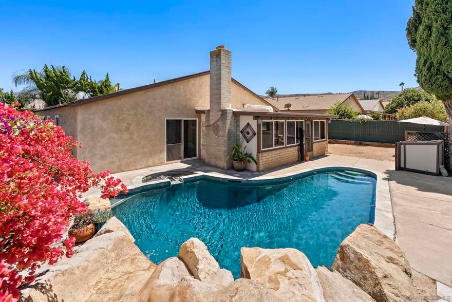 Introducing 13024 Standish Drive, a charming single-level home in Poway, now available for the first time. This property offers 5 bedrooms and 2 bathrooms, set on a generous 7,800-square-foot lot. The backyard highlights a sparkling pool with a spa and slide. Additional yard space can be used for entertaining, gardening, play, storage, or potentially an ADU. Inside, you'll find a freshly painted interior and an open kitchen equipped with granite countertops, wood cabinets, and stainless steel appliances. The enclosed sunroom offers an extension of the living space with a fireplace for added comfort. Additional features include an attached 2-car garage, RV and boat parking, a newer roof, and a covered front porch. This home is part of the Poway Unified School District and offers convenient access to local shops, dining, a farmer's market, parks, and hiking trails.