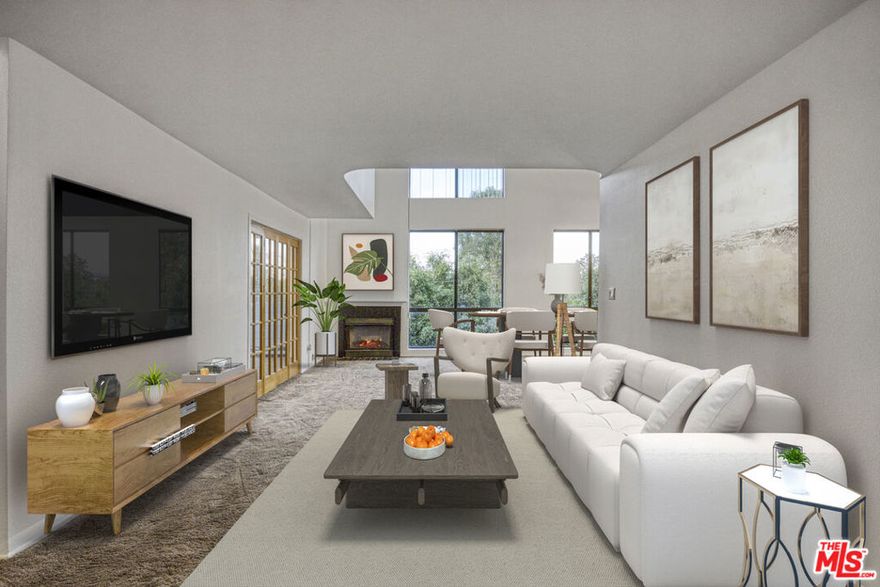 Experience the ultimate top-floor lifestyle in this stunning Sherman Oaks Penthouse unit! Bathed in natural light, this contemporary condo boasts an open-concept design with dramatic, soaring high ceilings and skylight, creating an airy, luxurious atmosphere. The main level features a spacious living room centered around a cozy fireplace, perfectly complemented by oversized windows that capture serene tree-top views. A modern French door separates the versatile second bedroom/den, which is ideal for a home office or guest room. A stylish full bathroom completes this floor. Ascend to the private, upstairs Master Suite loft, a tranquil retreat featuring a sleek modern bathroom, a closet and a generous flex space perfect for a custom dressing room or a dedicated workspace. Beyond your door, enjoy resort-style living with incredible amenities, including two shimmering community pools, a spa, a newly remodeled gym and sauna, and a recreation room. Two tandem parking spaces and a storage area are included. The HOA covers everything for worry-free living: earthquake insurance, basic Cable TV, Internet, hot/cold water, trash, and maintenance. Located moments from Ventura Blvd's best dining and shopping. This modern masterpiece is an absolute must-see.