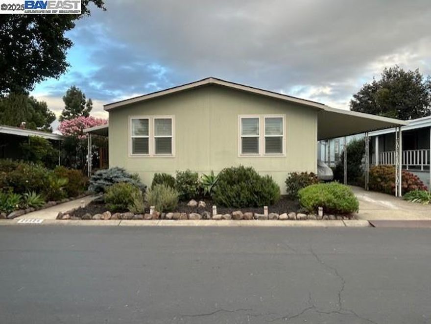 Welcome home!  Luxurious Newer, 3 bedroom, 2 bath Manufactured home in New England Village (adult community). This beauty has dual pane windows w/ plantation shutters, LED lights and 4 ceiling tubes that flood this home with light and a gas fireplace. Custom kitchen that boasts a wine fridge, GE Stainless appliances, 5 burner built in stovetop, built in microwave and wall oven, refrigerator. Large Laundry room w/ lots of storage, built in freezer, and washer and dryer that stay. Central heat and newer A/C unit. Primary suite with private bath and opposite end guest rooms. Rare rear yard space, large side deck, storage shed, and more! Fireplaces: GAS,LIV